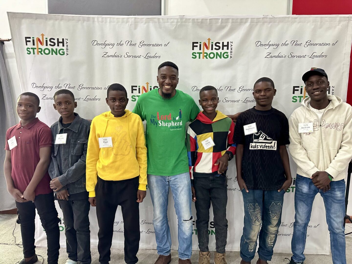 A group of young men posing at a Finish Strong Foundation event.