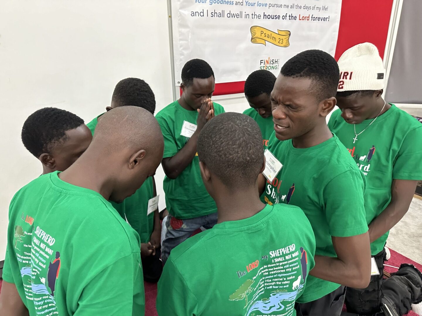Gathering of men in prayer circle