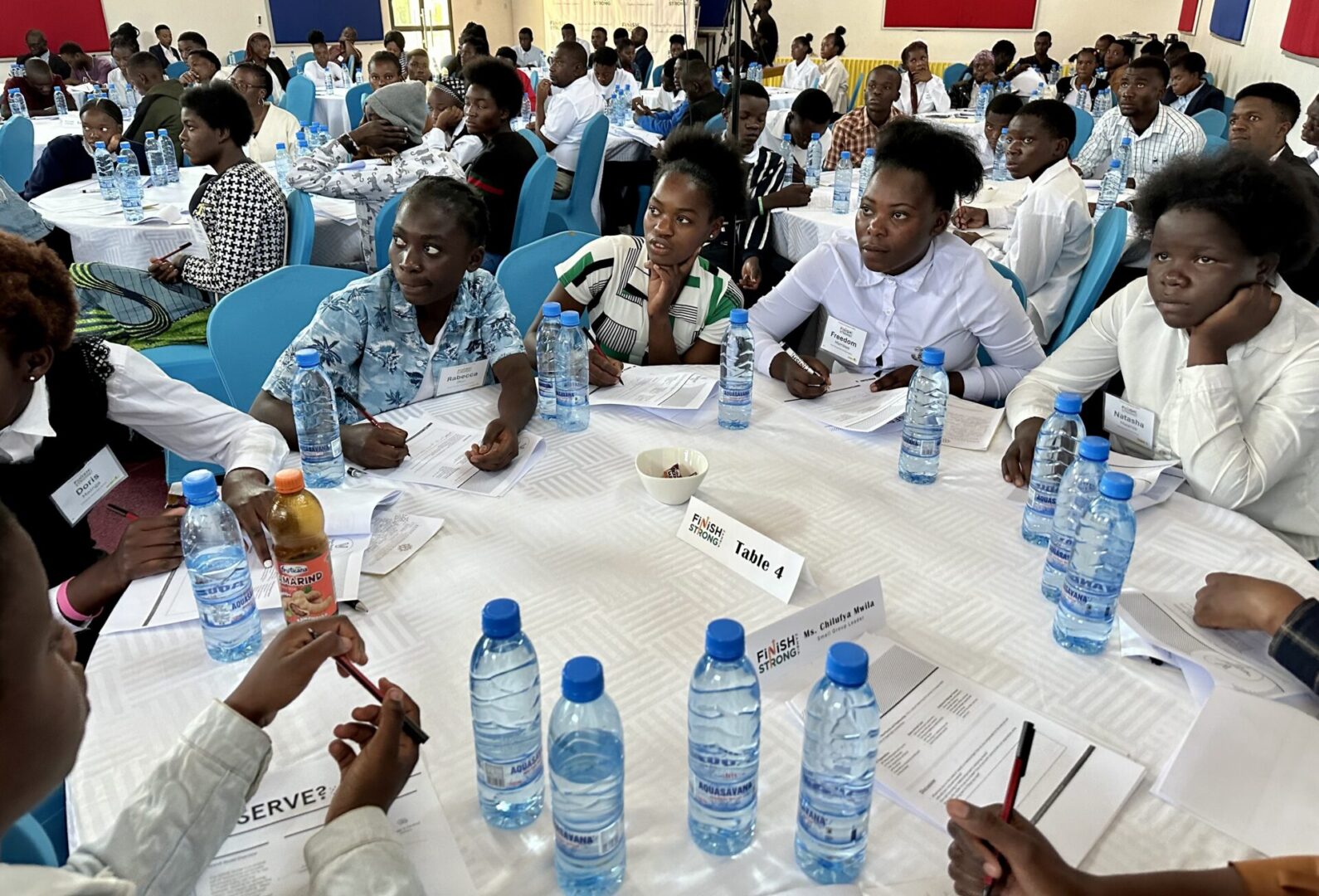 People discussing around a table at a conference