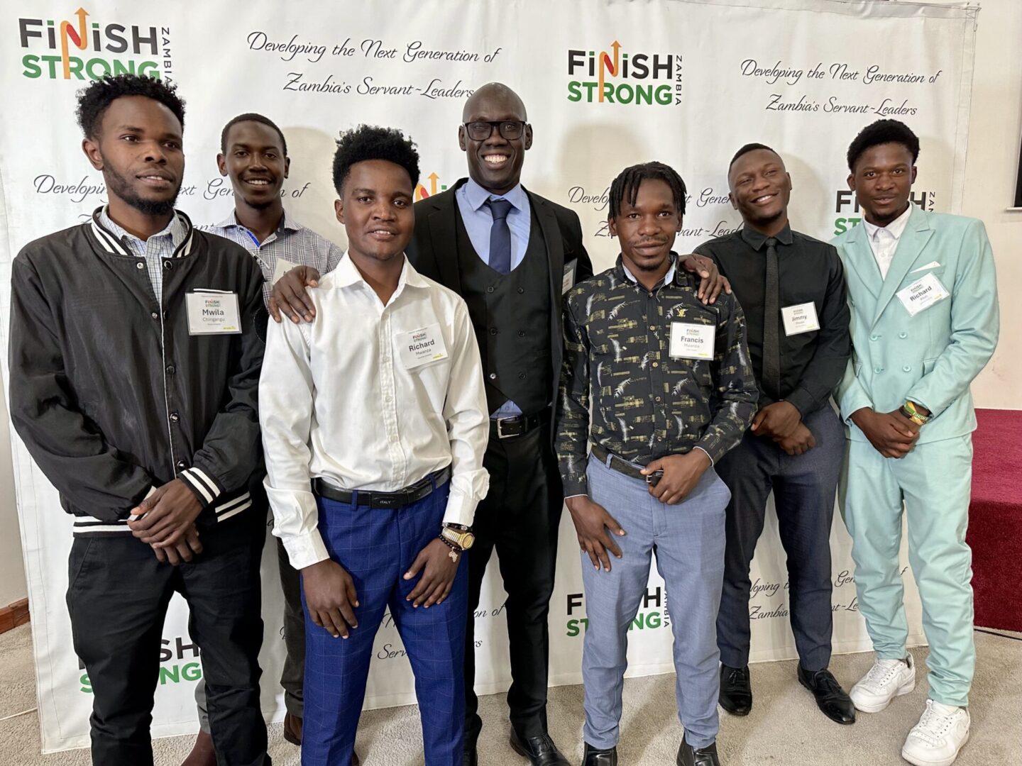 Group of seven men at event