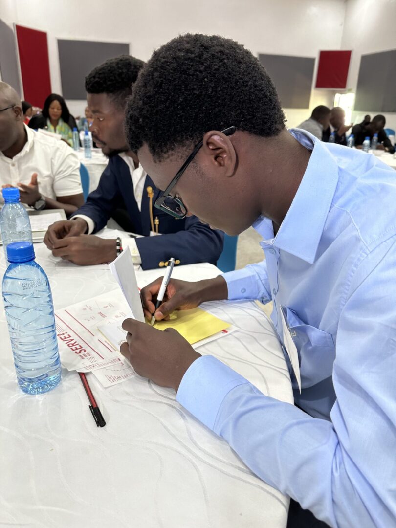 Conference attendee taking notes