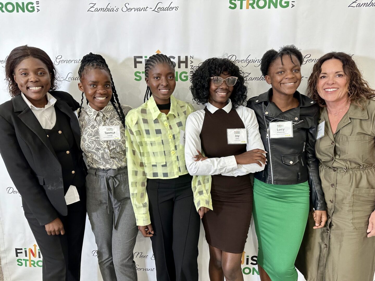 Diverse group posing at conference