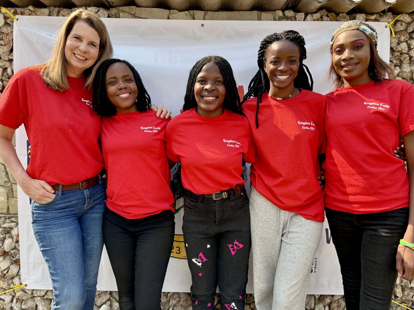 Diverse group in matching red tops