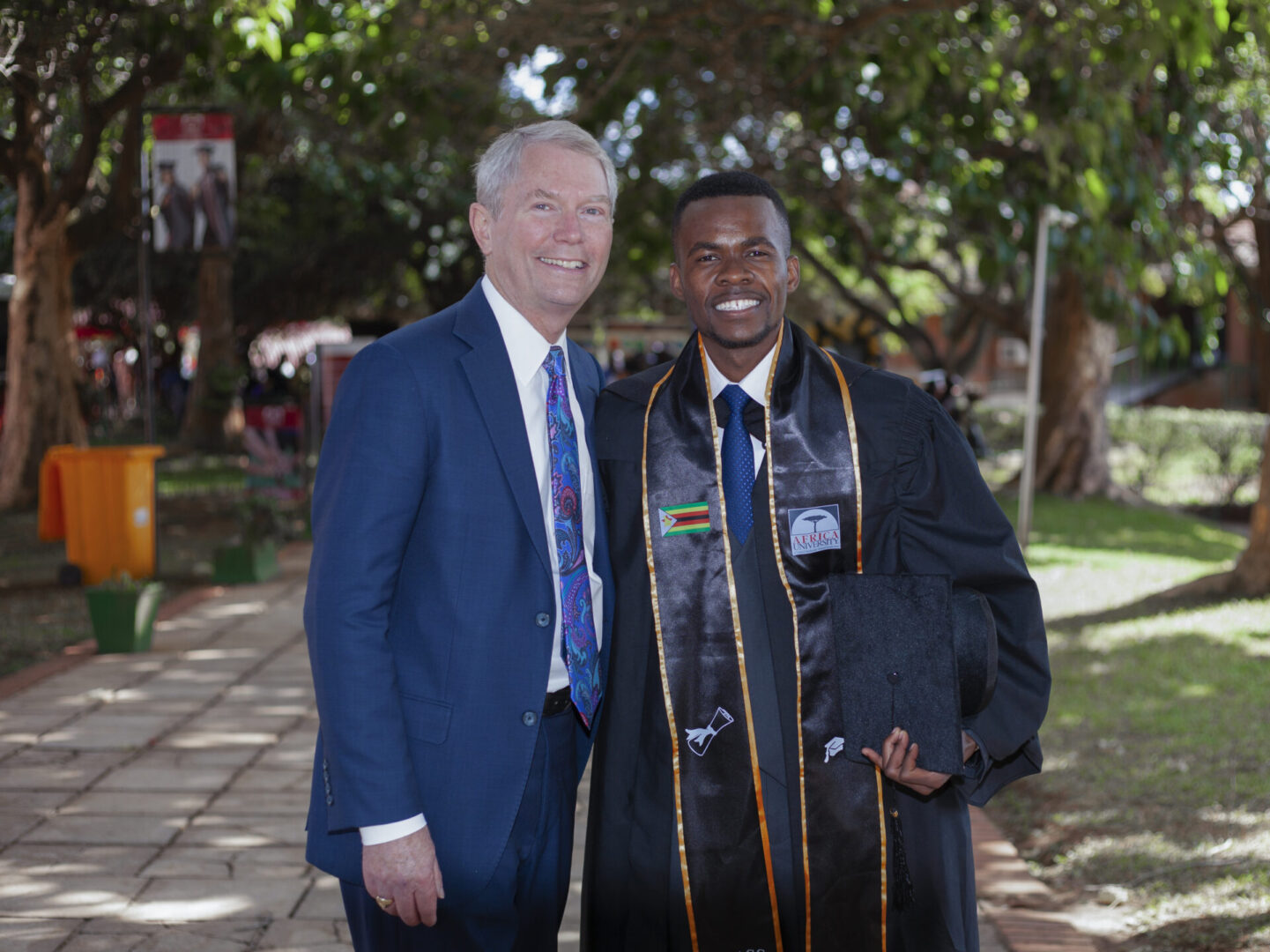 Smiling graduate in cap and gown