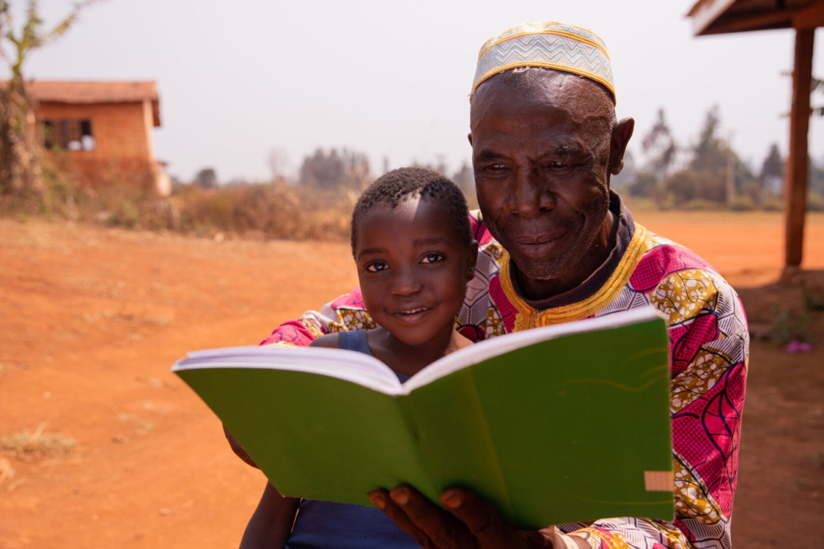 Grandparent and child reading together